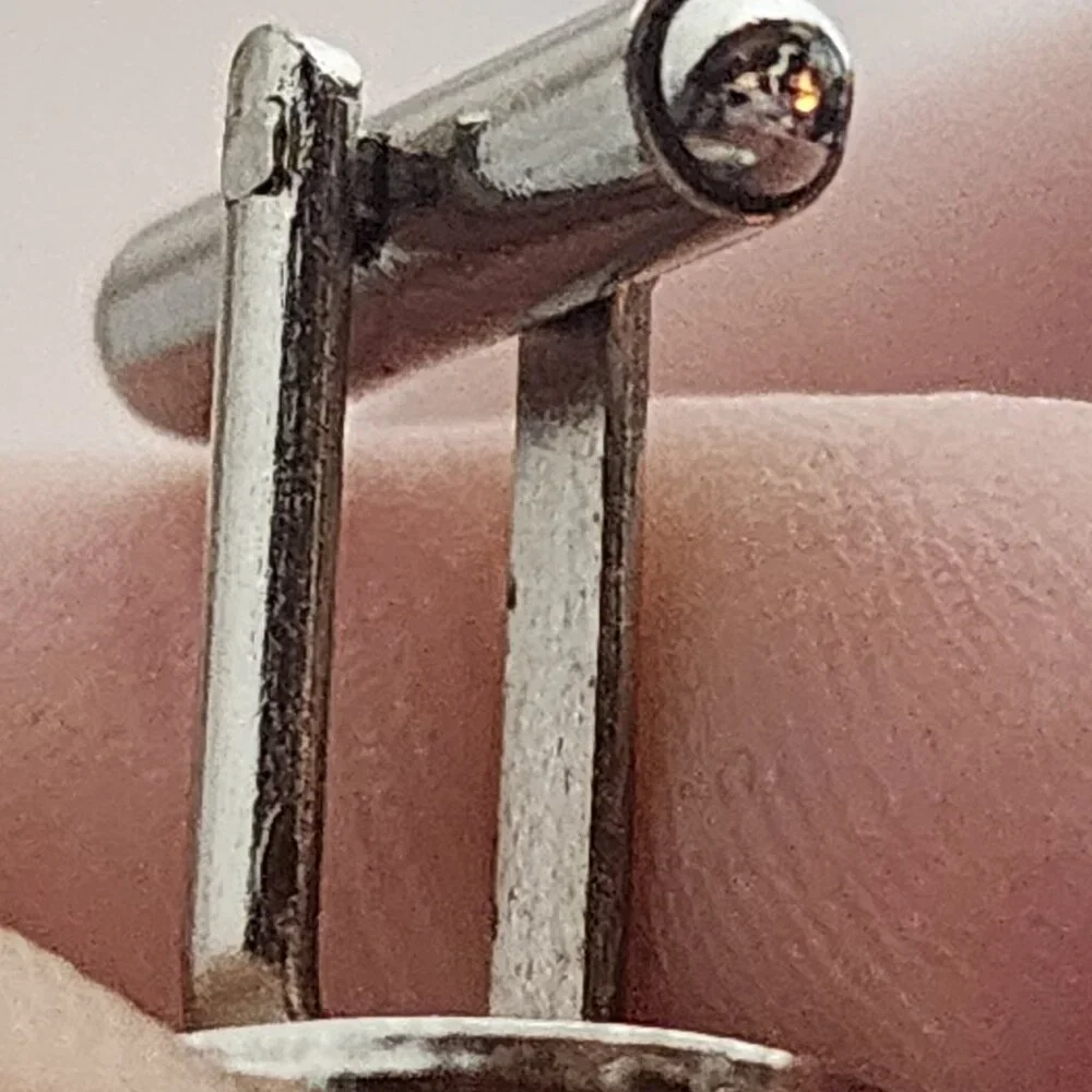 Source Unknown minimalist silver